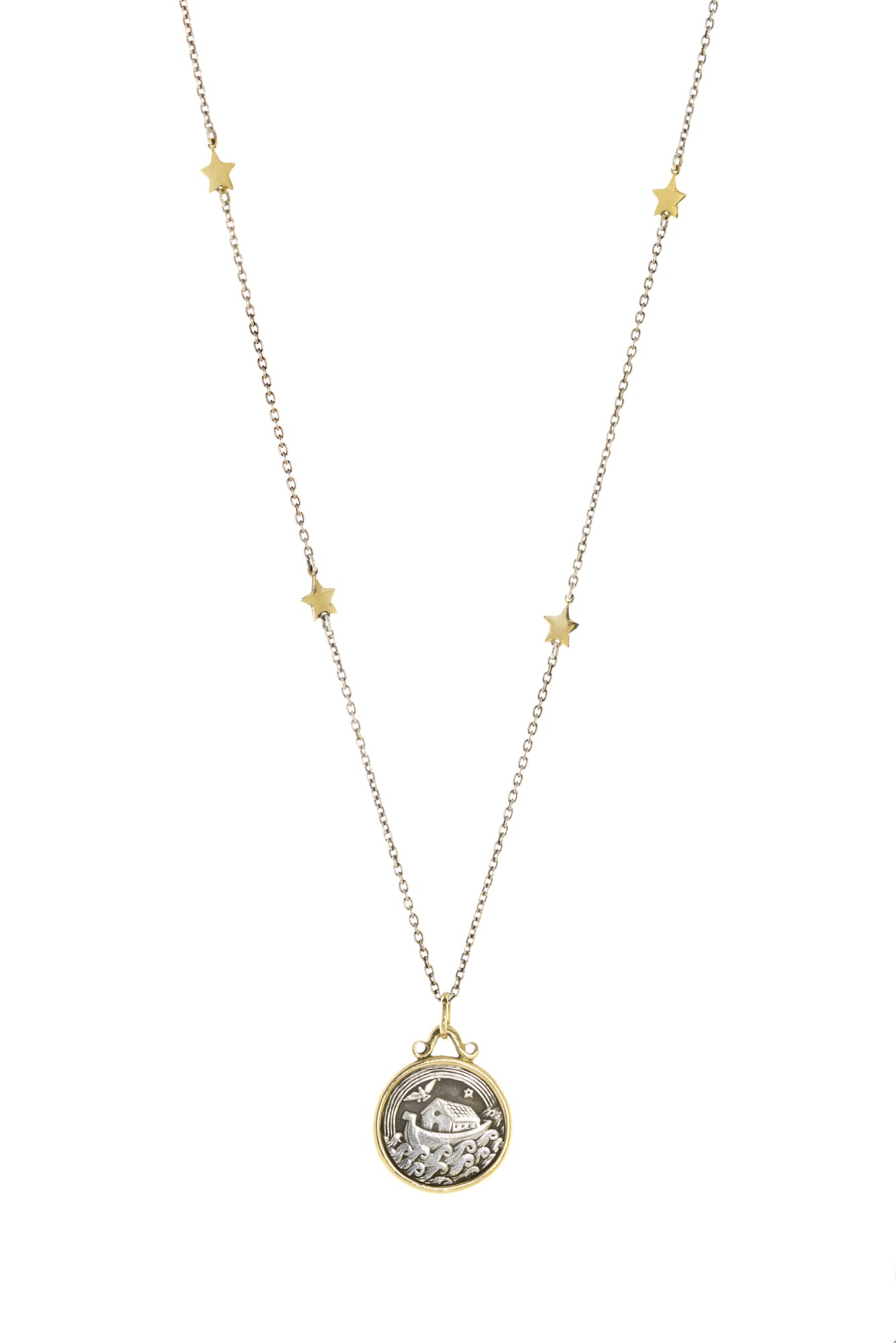 The Noah's Ark pendant in 14k gold and sterling silver, suspended from a handmade gold star chain